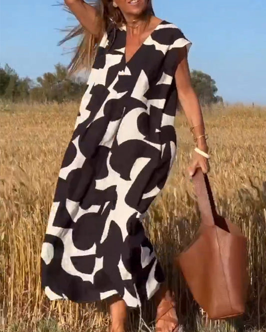NAOMI™ | Abito Lungo Stampato con Scollo a V e Linea Svasata per un Look Estivo