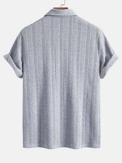 POLO IN JACQUARD GEOMETRICO LAVORATO A MAGLIA