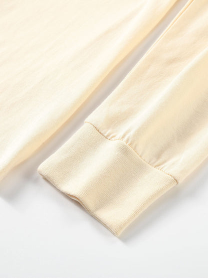 T-SHIRT A MANICHE LUNGHE PESANTE CON ORLO CURVO